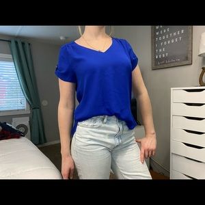 blue v neck professional top with gold details